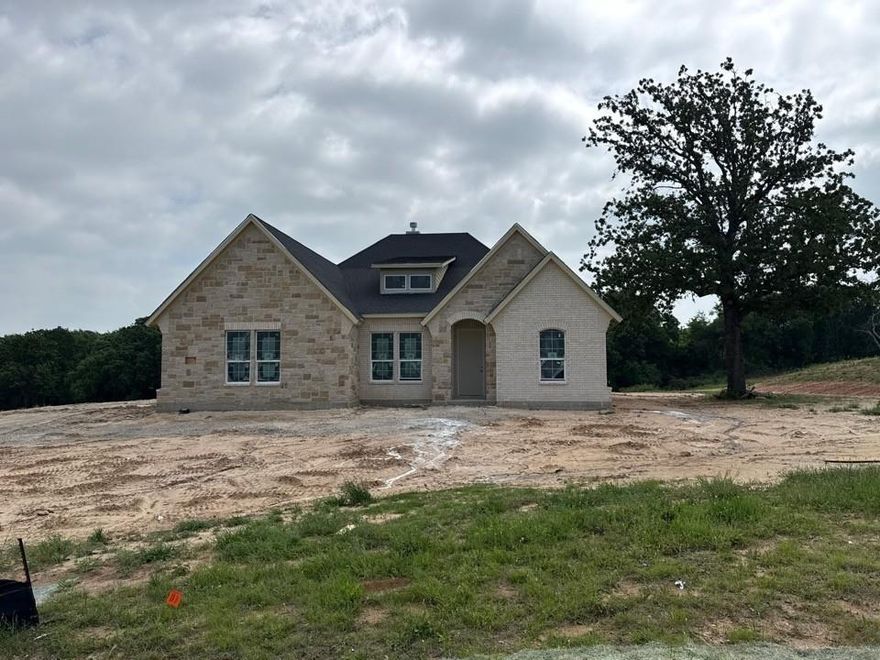 Estimated July 2026 completion! Ask us about our Trade In Trade Up program, we can buy your home! Step into the Bluebonnet by Riverside Homebuilders and embrace a lifestyle of comfort and functionality. With 4 bedrooms and 3 bathrooms sprawled over 2,686 square feet, this single-story haven offers ample space for every member of the family. As you enter through the inviting porch, the airy foyer sets the tone for the home's open layout. To the left, a flex room awaits, beckoning to be transformed into your ideal space—whether you envision a home office, gym or hobby room. Continue through the foyer to discover the heart of the home—a luminous dining room bathed in natural light. Beyond lies the main living area, a seamless fusion of the expansive kitchen, cozy family room featuring a fireplace and a charming nook adorned with picturesque windows. On the right wing of the home, privacy awaits with three traditional bedrooms and a breathtaking owner's suite. The owner's retreat boasts a spacious walk-in closet and a spa-like bathroom, offering a sanctuary for relaxation. Convenience is paramount with the laundry situated just off the bedrooms, accompanied by a mud bench near the garage entrance. To embrace the beautiful DFW weather without having to leave your home, step outside to the generous covered patio—where endless possibilities for outdoor enjoyment await. With its thoughtful design and inviting atmosphere, the Bluebonnet embodies the epitome of charming Texas living for all families alike.