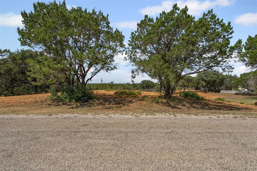 Located in the established Spanish Trail community, this .638-acre lot offers endless possibilities for you to bring your vision to life. Choose your preferred builder, create your dream floor plan, and build the home you’ve always wanted in a neighborhood that combines privacy, convenience, and charm. Spanish Trail offers more than just a prime location, there is a community pool, tennis & basketball court, a pavilion and a boat ramp, and is just a short drive to shopping and dining. The Historic Granbury Square is nearby, where you can immerse yourself in rich local history, community events, and unique shopping and dining experiences. It’s the perfect blend of tranquility and accessibility. Come see for yourself—this lot is ready for your dream home!
