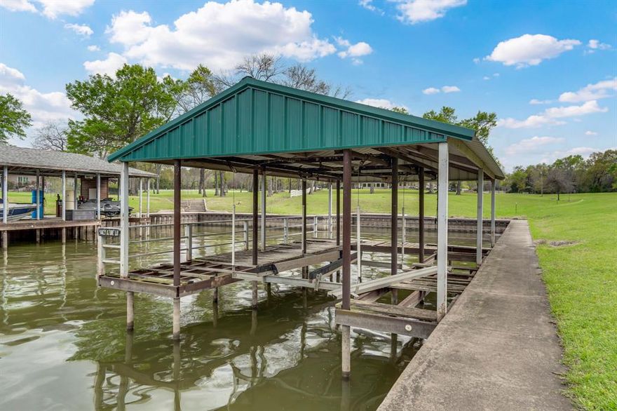 Rare opportunity to own over 1 acre of prime waterfront property on Richland Chambers Reservoir with breathtaking open water views. This beautiful lake lot is ready for your dream home and already features a covered boat dock and durable steel seawall, making lake life easy from day one. Imagine waking up each morning to panoramic water views, stepping out to your dock, and heading straight onto the lake for early morning fishing or a relaxing cruise—your boat never has to leave the water. With plenty of space to build and room to enjoy the peaceful surroundings, this property offers the perfect setting for a full-time residence or weekend retreat on one of North Texas’ premier fishing lakes.  Lot is cleared with a few large trees. Deck boards need to be replaced on dock along with electrical work needed, but the bones are good with a cradle lift.