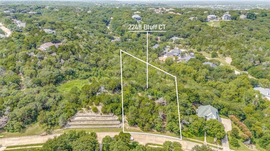 Build Your Dream Estate with Breathtaking Lake Views – 2248 Bluff Court, Cedar Hill, TX 75104. 

Perched on one of the highest points in DFW, this stunning 1.3-acre lot offers panoramic views of Joe Pool Lake and a rare opportunity to create a private retreat in a prestigious, luxury-home community. Nestled at the end of a quiet cul-de-sac, this elevated property features mature shade trees and endless potential to design a custom home with unmatched serenity and space. Located in highly sought after Lake Ridge community. 

Enjoy peaceful surroundings while staying just minutes from Joe Pool Lake, Tangle Ridge Golf Course, scenic trails, parks, and playgrounds. Despite its tranquil setting, you're only a short drive from downtown Dallas and DFW Airport—offering the perfect balance of seclusion and convenience.

Survey available. Don't miss out on this incredible opportunity to build your dream home in a truly exceptional location.