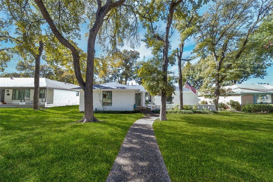 Experience a home where timeless mid-century architecture meets contemporary sophistication. Every corner of this reimagined residence is bathed in natural light, creating an airy, welcoming atmosphere that effortlessly extends from the living spaces to the private outdoor courtyard.
Entertain in style in the chef’s kitchen, complete with premium Café appliances, custom maple cabinetry, and a dramatic oversized island. A six-burner gas range, butler’s pantry with dry bar, and artful glass-accent shelving make this space both functional and visually stunning. The open layout, complemented by wide-plank oak floors, invites seamless gatherings with family and friends. The primary suite is an intimate retreat, offering direct courtyard access, four generous closets, and a spa-inspired bath with dual vanities and a glass-enclosed shower. The secondary bath features a deep soaking tub and a striking designer accent wall, creating an additional layer of style and serenity. Outside, the private courtyard offers mature trees and open space to landscape as you wish, a serene backdrop for quiet mornings or unforgettable evenings under the stars.  A whole-house generator ensures year-round comfort and peace of mind. All of this resides in one of Dallas’s most coveted enclaves, mere minutes from White Rock Lake, the Dallas Arboretum, and Downtown. This is more than a home, it’s a lifestyle designed for those who value elegance, comfort, and connection.
AVAILABLE LEASE TO OWN