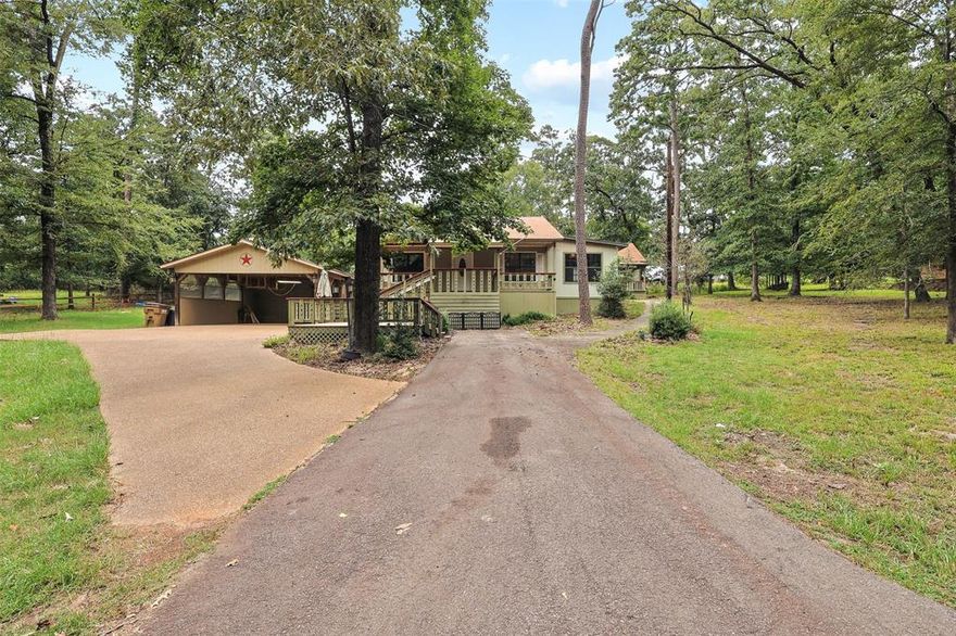 Charming Woodland Retreat in Holly Lake Ranch Resort! Nestled on a serene, wooded lot in the desirable gated community. This charming 2-bedroom, 1-bath home is your gateway to peaceful living surrounded by nature. Enjoy the beauty of the outdoors from multiple covered porches and extensive deckingperfect for relaxing or entertaining. The property includes a 2-car carport with a cooled, insulated workshop ideal for hobbies or projects, and a separate storage building with its own covered porch. Nature lovers will appreciate the abundance of deer and wildlife roaming the area, as well as the tranquil setting under the shade of East Texas pines. Holly Lake Ranch offers a wealth of amenities including golf, lakes for fishing, a swimming pool, tennis courts, pickleball, and walking trails. Conveniently located near the fire department, churches, shopping, and a private landing stripand within comfortable driving distance of major cities like Dallas and Tylerthis property offers the best of both worlds: a quiet retreat with easy access to urban conveniences. Whether you're seeking a full-time residence or a relaxing weekend escape, this one has it all!