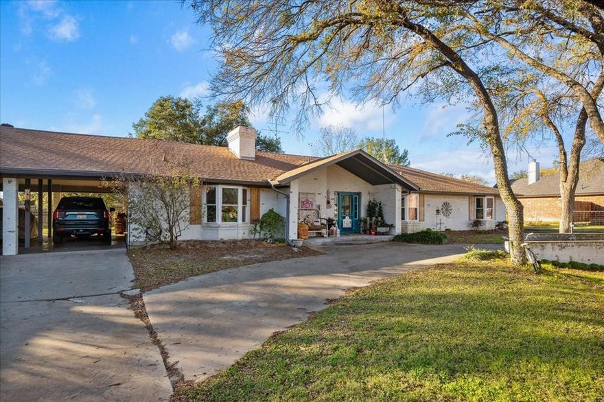 This is the ONE you've been waiting to come on the market!  Main home features 4 bedroom and 2 baths in a beautifully remodeled ranch style brick home, walk through the attached large 2 car carport to guest quarters, craft room or 650 sq. ft man cave with full bath.  The beautiful home has a circle drive plus an additional lot with additional driveway and parking.  This is a perfect home to entertain in with lg. living area and beautiful backyard oasis including a pergola, mature trees and covered porch.  The kitchen is a masterpiece with exposed brick and German Schmear finish and to the chef's delight, double ovens, island with cooktop built in, granite countertops. The home has other special features including a book nook in your entry way, complete master bath remodel with oversized walk-in-shower with some handicap features if needed, huge master bedroom at the end of the hallway for privacy, several bay windows and window seats.  All of the floors are easy clean laminate with new carpet in bedrooms.  Windows have recently been replaced throughout the home with an expense of 40k+!!  You are within 2 miles of all grocery stores, restaurants and shopping including old downtown coffee shops, antique stores and restaurants.  Bring your most discerning buyers, many more amenities not listed here.  Check the transaction folder for a list.