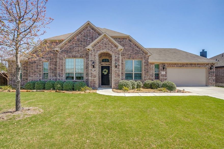 Built in 2019, this beautiful 1-story brick home resides on a 0.395 acre, corner lot located in Keller ISD! Featuring 3 bedrooms plus a separate home office (office could be used as a 2nd living, playroom, or possibly a 4th bedroom), 2 full and one-half bathrooms, and a 2-car garage. A favorite floorpan where the primary suite is split from the 2nd and 3rd bedrooms. The primary retreat includes an oversized bedroom with views to the backyard, ensuite bathroom with dual sinks, soaking tub, a large walk-in shower with a huge walk-in closet! Relax or entertain in the spacious main living room with focal fireplace and a wall of windows showcasing views of the backyard and green space just beyond. Enjoy the open kitchen with island and breakfast bar seating, stainless steel appliances and granite countertops, plus ample storage, corner pantry, and a lovely window surrounded dining space. High ceilings, tons of storage, engineered wood flooring and separate laundry room make this home not only gorgeous but functional too! The backyard is the perfect spot to spend your time playing in the massive backyard or lounging under the covered patio or on the open deck. It's very rare to find such an amazing home like in the most convenient location close to Alliance's shops, restaurants and retail. Welcome home!