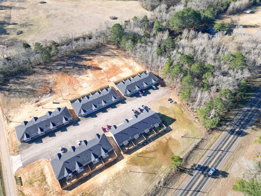 New construction 20-unit multifamily investment opportunity located at 150 Stevens Road in Hallsville, Texas. This property consists of five quadplex buildings totaling 20 units, thoughtfully designed with quality construction and modern finishes. Each unit features granite countertops and high-efficiency systems, offering durability and strong tenant appeal. Located within the highly sought-after Hallsville ISD, the property benefits from strong rental demand in a growing East Texas market. As a brand-new construction asset, this investment offers minimal deferred maintenance and excellent long-term income potential.
