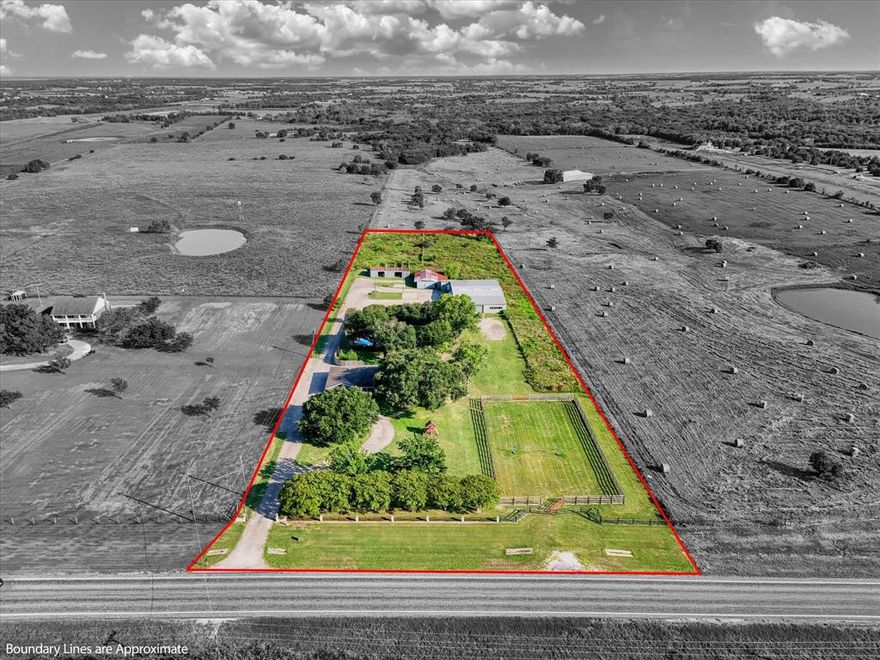 Fabulous 3,784 sq. ft. residence that offers 5 bedrooms, 4 bathrooms, and is perfectly situated on 5 picturesque acres plus a 6,500 + sqaure foot shop. Walk into this beauty and arrive in the spacious family room, featuring vaulted ceilings, custom built-ins, views of the backyard and pool, and an open flow into the dining area.

At the heart of the home, the chef’s kitchen shines with granite countertops, custom cabinetry, a farmhouse sink, double ovens, cooktop, dishwasher, pantry, and breakfast bar. Flowing seamlessly into the breakfast area, formal dining room, and vaulted living room, it’s designed for both everyday living and effortless entertaining.

The secluded primary suite is a private retreat featuring dual walk-in closets, direct patio access, and a spa-inspired ensuite with granite countertops and a tiled walk-in shower.

All bedrooms are gracious in size and closet space.



Step outdoors to your very own resort-style oasis complete with a sparkling in-ground pool and spa, expansive sun-soaked terrace, and cabana—perfect for summer gatherings.

For the hobbyist, entrepreneur, or equestrian, the property features a 6,668 square foot workshop (previously a cabinet-making shop) with electricity, an office, and half bath; a barn; and a shed with covered stalls. Every fenced section is equipped with its own water access, making the land ideal for cattle, horses, or other livestock.

Additional highlights include a secluded area that consists of approx 880 square feet that serves as gameroom with sink, mini fridge and built-ins, plus there is a circular driveway, excellent parking spaces, two-car garage, carport, and lush landscaping with mature trees that provide beauty and privacy. NEW ROOF 2025.

A rare opportunity—this exceptional property is priced to sell and truly offers a little piece of heaven in Texas.