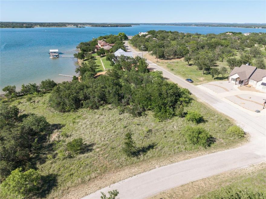 The lake is full and summer is quickly approaching. Bring your builder to this highly desirable lake front property in beautiful Feather Bay on Lake Brownwood. Come enjoy the award winning Hideout Golf Resort, Pool, Incredible Dining, RV Hookups and much much more all with in the awesome confines of the Feather Bay subdivision. Quick access to Brownwood, TX and easy access to I20 that can get you to Dallas, Fort Worth or Midland ,Odessa. The lot itself has some mature trees and gently slopes to the lake. Making this a easy build location for that custom home you've always wanted. This is a double Lot at the mentioned price. The Lots can be purchased separately if one desires.