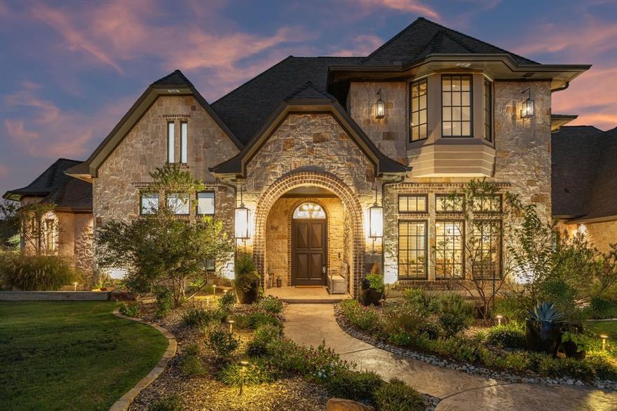 Luxury, Privacy, and Breathtaking Views in an Equestrian Paradise.

Nestled in a prestigious equestrian community with scenic riding trails, this stunning custom home offers peaceful living and luxurious amenities—all zoned to the highly sought-after Argyle ISD with one of the district’s lowest tax rates and located within a 5 minute drive to Liberty Christian.

Boasting 5 spacious bedrooms all ensuite (with one currently used as a guest room or second office), 5 full baths, and a half bath, this home was fully remodeled in 2017 and recently updated with new interior paint (2025), new carpet (2025), and beautifully refinished wood floors. Enjoy the serenity of your morning coffee or evening wine on the screened-in back patio overlooking a tranquil pond with fountain and floating dock, where unforgettable sunrises greet you daily.

The backyard is your private retreat with a heated pool, in-ground hot tub under a covered cabana, and a well with filtration system dedicated to the full exterior irrigation. A 10,000-gallon water storage tank ensures top-tier pressure for your lush landscaping.
The oversized 4-car garage features an epoxy floor, climate-controlled workout room, and a cedar-lined gun safe room, plus an elevator lift to the attic and a nearby in-ground storm shelter. Additional upgrades include new garage doors, central vacuum, and freshly re-stained cedar exterior woodwork (2025).

Truly private, exceptionally maintained, and move-in ready—this home is a rare opportunity in a peaceful, upscale setting. Come experience luxury country living at its finest!