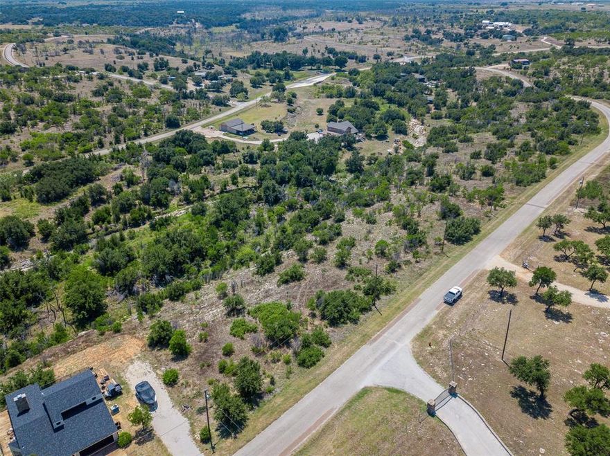 Build your dream home on this beautiful 2.6+ acre lot near the iconic Hell’s Gate at Possum Kingdom Lake. Located in the highly desirable Sportsman’s World community, this property offers a fantastic building site with ample space, privacy, and access to all the neighborhood amenities.
Enjoy the convenience of community features including a pool, tennis courts, playground, and the Bluff Creek Marina with available annual wet slip rentals. This area is also located within a Municipal Utility District (MUD), offering cost-effective utility services for future homeowners.
Whether you're looking for a full-time residence, a weekend escape, or a short-term rental investment opportunity, this lot delivers the flexibility and location to make it all possible.
Don’t miss this opportunity to create your perfect lake retreat in one of Possum Kingdom’s most iconic areas.