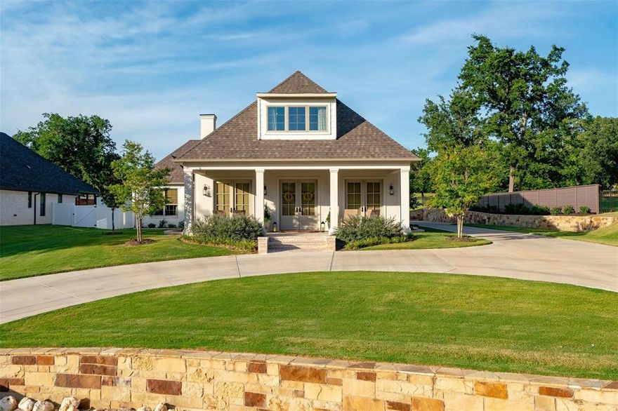 More Photos to Come!  Charming Cottage Style Retreat in PECAN PLANTATION set on over one half ACRE across from the HISTORIC BRAZOS RIVER. Enjoy 4 bedroom, 3 full bathroom Custom Built home that offers a rare blend of Southern Charm with Efficiency! Inside, the home is filled with natural light, 10 ft. ceilings, oversized rooms, and inviting open layout. The expansive living area offers both comfort and sophistication, featuring a custom cabinet that discreetly conceals the TV when not in use situated over an electric fireplace adds warmth and ambiance creating a perfect spot to relax or entertain. The well designed kitchen with quartz countertops, combines functionality with style, featuring sleek undermount lighted floating shelves that offer both display and easy access to everyday essentials. Reverse osmosis water system. High end appliances are integrated for clean modern look and superior performance. At the heart of the kitchen is a large center island, complete with built in storage underneath and a drawer microwave. The spacious primary suite offers a crowned ceiling that adds an elegant touch, along with a cozy sitting area perfect for unwinding. The ensuite bathroom features relaxing soaking tub, large separate walk-in-shower, and dual sinks. A versatile first floor bedroom offers the flexibility to serve as a private quest room or home office. Upstairs, you will find two comfortable bedrooms with walk in closets and a well appointed full bath ideal for family and friends. The Laundry room is equipped with a farm sink and additional refrigerator. Energy efficient items include Foam Insulation, Low E windows, Orchard water for lawn, 2024 class 4 roof, 5-ton 2 phase 16.25 sear Trane AC with 3 zones, adds year-round comfort and lower utility costs. Several custom interior design features include woven blinds, hidden TV cabinet above electric fireplace, 8 inch base boards, wood beams, ceramic wood look tile and floating shelves. Fully Fenced, Electric Gate.