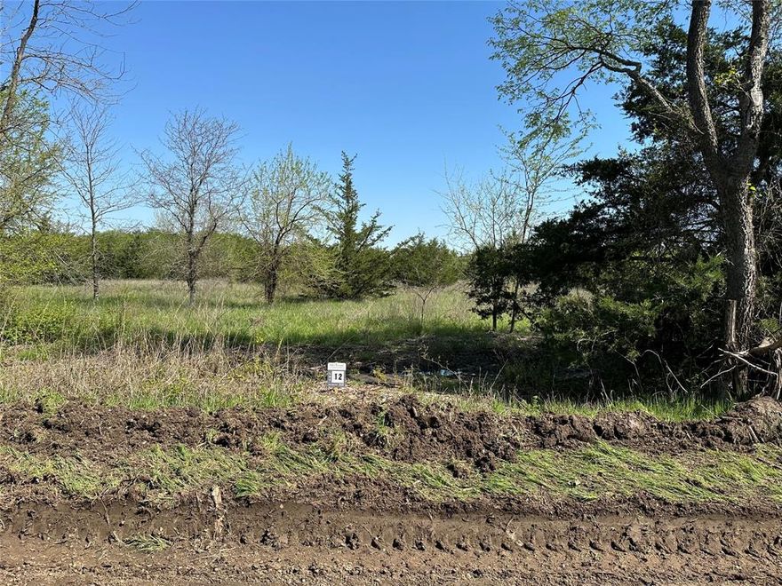 Rare Opportunity to purchase 5 acres of hard-to-find land near the brand-new Bois D Arc Lake. With the lake estimated to open in 2024, secure your property while it is still affordable. Bois D'Arc Lake Estates is offering introductory pricing on the first 10 lots sold before prices are raised 40% on the remaining 14 parcels. Beautiful, scattered hardwood trees on nice roads close to the public boat ramps on FM 897. Water is now available along FM 1743 parcels and will be extended to all parcels soon. These lots fall into the new lake zoning of 5-acre minimum parcels. 24 parcels in total are being offered in 5- and 10-acre configurations. TX.D.O.T. culvert permits have been submitted, and Water Will-Serve letters are in-hand. Septic is required. Lake is about 90% full and opens to boats soon. The lots are on the FUN side of the lake designed for recreational boating. Owner Lending, 15% Down, 10% Interest, 5 Year Note.  Purchase of this tract will come with a new 30x30x12 metal shop. Includes delivery and installation, but no concrete foundation is included.