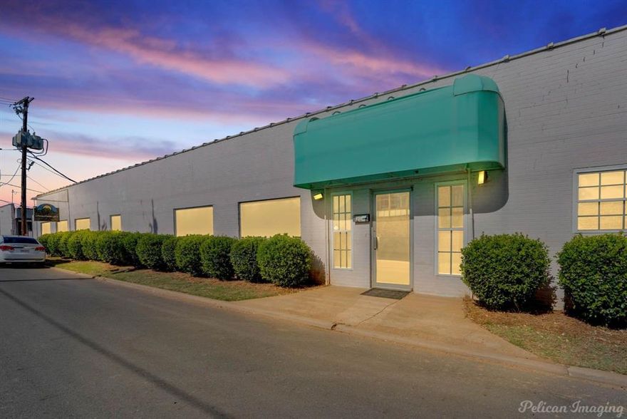 This 20,618 SF industrial warehouse features approximately 1,900 SF of office space with a lobby, five private offices, a break room with appliances, multiple storage rooms, and two restrooms, including one with a shower. The warehouse includes three bays with sliding doors on each side (six total), six cranes, and large recessed service or assembly pits with overhead rail systems. The property also offers two separate water meters, one for the building and one currently used for spray tank fill-ups. Recent improvements include a new HVAC system installed in 2024, office space only, and a new metal roof in 2022. Zoned I2 (Heavy Industrial) this facility delivers extensive functionality and heavy-duty infrastructure. Agent is related to Sellers.