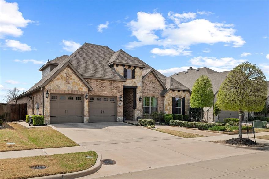 Welcome to 308 Bessie Coleman Blvd., a stunning blend of luxury, space, and style located in the highly desirable community of Waxahachie. This beautifully maintained 3-bedroom, 3-bath home offers over 3,000 square feet of living space and is designed for both comfort and elegance. Step inside to find rich hand-scraped hardwood floors, soaring ceilings, and an abundance of natural light. The open-concept living area features a cozy corner fireplace and seamlessly flows into the chef’s kitchen, complete with an oversized island, sleek cooktop, built-in stainless appliances, elegant backsplash, and pristine white cabinetry. Need space to unwind or entertain? This home features two spacious living areas, offering flexibility for a media room, game room, or home theater. The private home office with French doors and wainscoting adds charm and functionality. The primary suite is a peaceful retreat with a wall of windows overlooking the backyard, and the ensuite bath boasts a soaking tub, walk-in shower, dual vanities, and expansive walk-in closet. Out back, enjoy a generous covered patio and a fully fenced yard—perfect for play, pets, or future pool plans. Schedule your tour today and make 308 Bessie Coleman Blvd. your forever home!