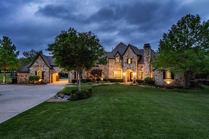 Welcome Home! This property is on a spacious 2-acre corner lot with stunning curb appeal. A 4-car garage & extra parking provide space to store all your vehicles. Inside, you'll find a beautiful office with built-in bookshelves, fireplace & rich coffered ceiling. The primary suite also features a fireplace, creating a cozy atmosphere. The chef's kitchen boasts a gas range & vent hood, built-in refrigerator, warming drawer & 2 sinks. A wet bar with patio access & the downstairs media room make entertaining a breeze. The guest room has a Murphy bed for visitors & its shared bathroom has pool access. Upstairs has a game room that showcases a balcony with golf course views & a built-in wet bar & 3 oversized bedrooms with ensuite baths. Step outside to a massive patio with a fireplace, built-in kitchen, room for living & dining furniture, a fire pit & gorgeous pool & spa with a grotto. Enjoy your private sport court with a batting cage & pitching machine just steps away from your new home.