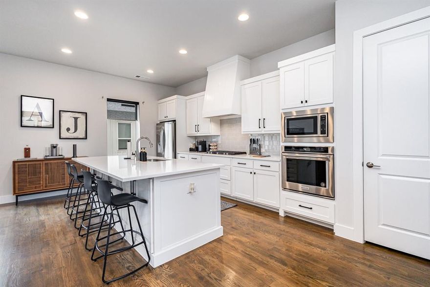 Welcome to this stunning detached townhome nestled in a gated community with a low HOA, offering the perfect blend of privacy, style, and comfort. Step inside to discover beautiful hardwood flooring, new carpet (2024), and a reimagined living area by adding a floor-to-ceiling accent wall with an electric fireplace that creates a warm, modern ambiance. Open concept kitchen features quartz countertops and abundant natural light, while each bedroom boasts its own ensuite bathroom for added convenience. Enjoy peace of mind with a tankless water heater and relax in your private green space, perfect for unwinding or letting your pet play freely. As a detached unit, this townhome qualifies for lower interest rates than typical attached properties, making it an incredible opportunity for homeowners seeking value, privacy, and modern luxury. Refrigerator, washer, dryer, and furniture are negotiable.