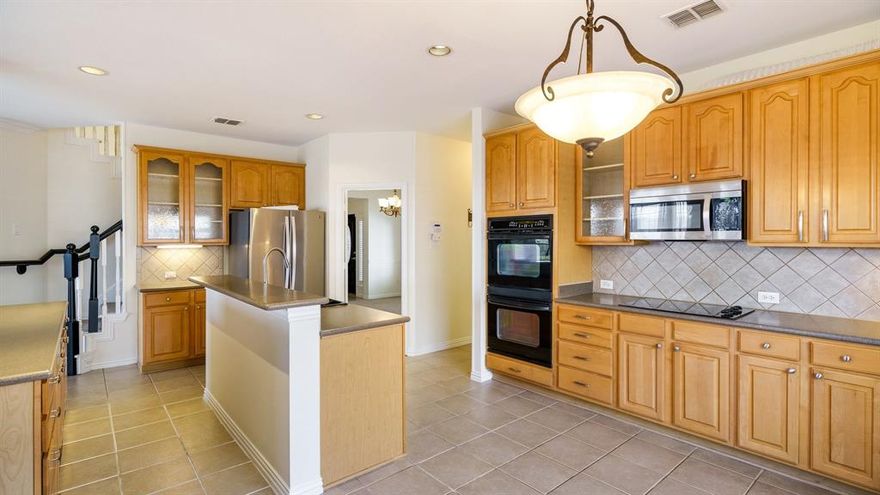 Updated golf course home in gated community with lots of natural light and open spaces.  Ready for a large family just in time for the holidays.  Five bedroom and four full bath two story with large balcony and covered patio.  Oversized Kitchen black appliances with double islands and spacious window seat breakfast area. The family,great room includes fireplace and great views of the backyard &  golf course.  Second story Oversized primary includes crown molding, jetted corner tub, separate vanities. Family size game room plus 3 secondary BRs upstairs; one BR down. Swing Garage treated epoxy floor and additional storage. Great community amenities include a clubhouse, pool, park, playground, golf, and tennis.  Frisco ISD