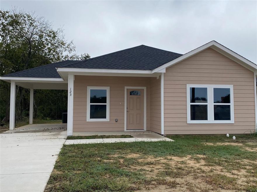 Newly constructed 3 bedroom, 2 bathroom home with Hardie siding.  Open kitchen, Living, Dining areas.  Flooring is luxury vinyl plank.  Separate utility room and a single carport.