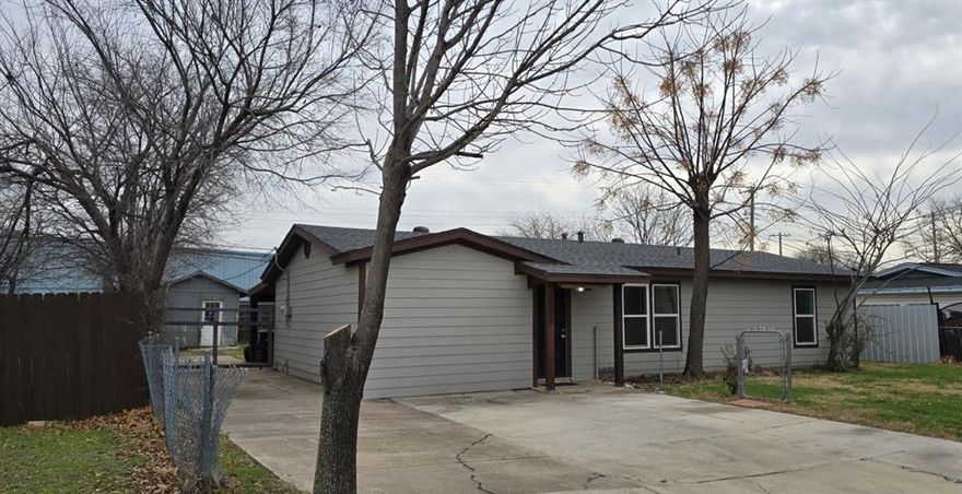 Charming home conveniently located near major highways, schools, and shopping. Features spacious living areas, a functional layout an additional structure located in backyard. Not included in living square footage. Permits unknown. Buyer to verify use and legality, with plenty of room to entertain. Great opportunity for first-time buyers or those seeking a rental property. Roof, siding and windows replaced in 2021. Easy access to I-35W and downtown Fort Worth and close to the Stockyards.