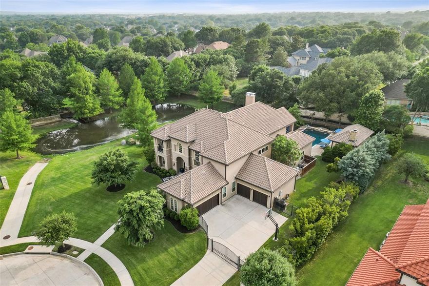 Stunning Southlake Estate on a prime lot overlooking a serene pond! A true custom home with an excellent floorplan and attention to detail throughout. The impressive entry offers a sweeping staircase, soaring ceiling, a private office, and an elegant dining room. Spacious family room with towering stone fireplace, and custom built-ins. The gourmet kitchen offers a center island, top of the line appliances, custom cabinetry, and a breakfast room overlooking the backyard. Off the kitchen is a bonus room with a wet bar, full bath, and direct pool access, perfect for summer entertaining! The master suite offers a cozy sitting area, private access to the patio, and a luxurious private bathroom. The second floor offers three bedrooms, each with a full bath, a deluxe media room, and a game room with a wet bar and balcony. Outdoor living at its finest with a sparkling pool with spa and a custom cabana with outdoor kitchen, and living space with fireplace!