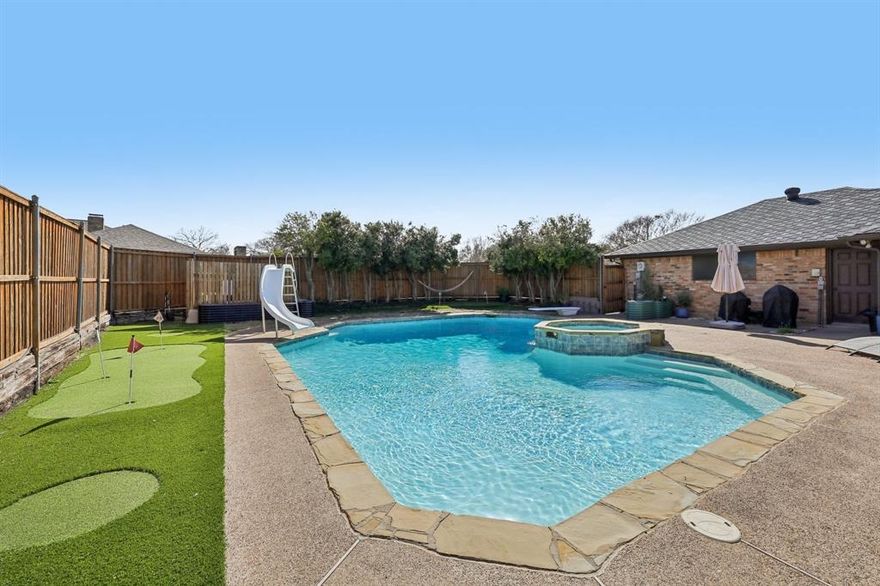 Price improvement + $5,000 seller credit creates one of the best opportunities in the neighborhood. Situated on an oversized corner lot in a quiet cul-de-sac, this spacious 4-bedroom home offers a flexible layout, multiple living areas, and room to make it your own.

A charming gated courtyard welcomes you inside to an inviting living space centered around a cozy fireplace—perfect for both everyday living and entertaining. The thoughtfully designed floor plan includes spacious bedrooms, a Jack-and-Jill bath, and a private fourth bedroom with a nearby full bath—ideal for guests or extended family. A dedicated media room adds even more versatility for movie nights or game-day gatherings.

The primary suite provides a peaceful retreat with dual closets, an oversized soaking tub, and separate shower. Multiple dining areas—including formal dining, breakfast nook, and bar seating—offer flexibility for both casual and formal gatherings.

Step outside to your private backyard oasis featuring a refreshing pool with recent updates including 2024 replaster, new pump and salt cell, and a 2025 heater. The outdoor space is enhanced with new turf, a 5-hole putting green, and mature trees—creating a low-maintenance, resort-style setting.

Additional improvements include hail-resistant designer shingles, a 12-zone smart sprinkler system, Electrolux induction cooktop with double wall oven, and extensive 2025 interior updates including painted cabinetry, resurfaced counters, updated bathrooms, stained and scored concrete flooring, and fresh interior paint while maintaining the home’s original character.

This well-maintained home offers space, flexibility, and value in a prime Dallas location—now paired with a seller credit to help lower your upfront costs or monthly payment.