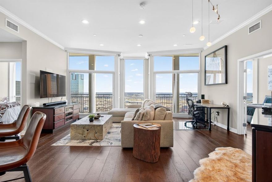 Experience luxurious lock and leave living in the heart of Downtown Fort Worth at The Tower! Located on the 32nd floor, this east facing two bedroom, two bath condo offers BREATHTAKING VIEWS IN EVERY ROOM and many updates that distinguish it from the rest! You will love the wide-plank wood floors, custom Kitchen Source cabinetry, granite countertops, and the stunning updated guest bath with designer tile. Electric shades in every room make enjoying the spectacular views effortless- just a click of a button! Additional highlights include: Double balconies, dedicated laundry room with full size washer and dryer, plenty of storage with walk in closets, newer HVAC (2023), 2 water heaters and elevated finishes throughout! Tower residents enjoy resort style amenities: 24 hour Concierge service, outdoor pool, fire-pit lounges, fitness center, rooftop terrace, outdoor dining, grills and MORE! Secured garage parking with one deeded parking space. Convenience is key here! It's a quick walk to Sundance Square, Bass Hall, and some of Fort Worth's best restaurants and only a short drive to Dickie's Arena, the Cultural District, and Trinity Trails! This is the one you've been waiting for-sophisticated, impeccably maintained, and in the most perfect location!
