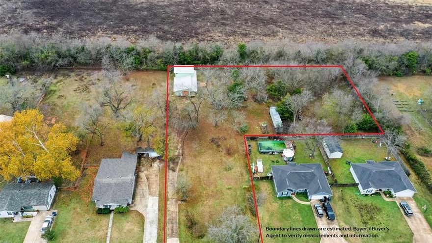 Rare 1.18-acre flag-shaped lot in the heart of Farmersville with water, electricity and city sewer already installed. Heavily treed with beautiful scenery, privacy and an array of Texas indigenous flora. Property includes a large buildable area, mature trees and two attached structures: a workshop with 8' door and a 2-story accessory unit (not permitted as a permanent dwelling- only for guests- Owner used for weekend vacation house). Backup generator included for the workshop-accessory unit building. City-approved 3BR, 2BA home plans available for purchase. A house once stood here—slab and utilities remain. City sewer grinder pump located at rear and connected to city sewer hook-up. Perfect for builders, investors or anyone wanting a spacious in-town homesite with privacy and room to grow.  There is a storage trailer on the property that will remain with the property.