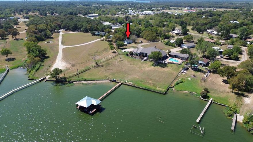 Searching for a lake house with breathtaking views of Lake Tawakoni? Look no further! This beautifully remodeled home is tailored to your needs, situated in the City of West Tawakoni. You will love this quaint lakeside community! This double lot offers ample space for relaxation away from big city living. The neighborhood includes private access to a community boat ramp and dock, merely a minute's drive from your doorstep. Lake Tawakoni is a 37,879-acre reservoir located in Northeast Texas, approximately 48 miles East of Dallas. This beautiful home features a fully updated interior and exterior with an open living area, walk in closets, gorgeous kitchen with granite counter tops, elegant built-ins, and a potential office with a lakeview! Includes covered parking for your needs. Come take a look at this adorable lake home before it is off the market!  All information deemed reliable must be verified by buyer and buyer's agent.