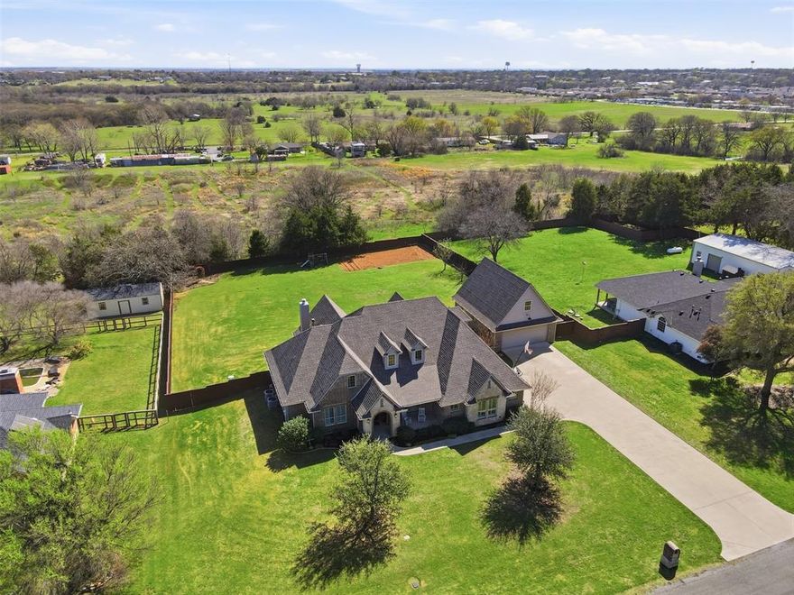 If you are looking for quality..stop and look no further! Relax in this luxurious Pilot Point custom single story w upstairs bonus room..just minutes from Lake Ray Roberts marina. Ample parking and storage for your boat and or shop! Situated on one acre and built by one of Pilot Point's premier cabinet makers. Organization is effortless with numerous custom built ins throughout the home. Upgrades include: farmhouse sink, double ovens, high end wood cabinetry, designer master closet system with shelving & island, vessel tub in primary bath, oak flooring in living, entry and kitchen, double-stacked crown moulding, plantation shutters, tankless hot water heaters, granite and quartz counters, double-wide concrete driveway, pier foundation added when built for support, sprinkler system, soft close cabinets...and much more. Detached garage features a massive upstairs unfinished room for storage, business, office or living quarters...your choice! Country living but still close enough to major shopping, restaurants, UNT, TWU and a commute to either Dallas or Fort Worth..the best of both worlds.