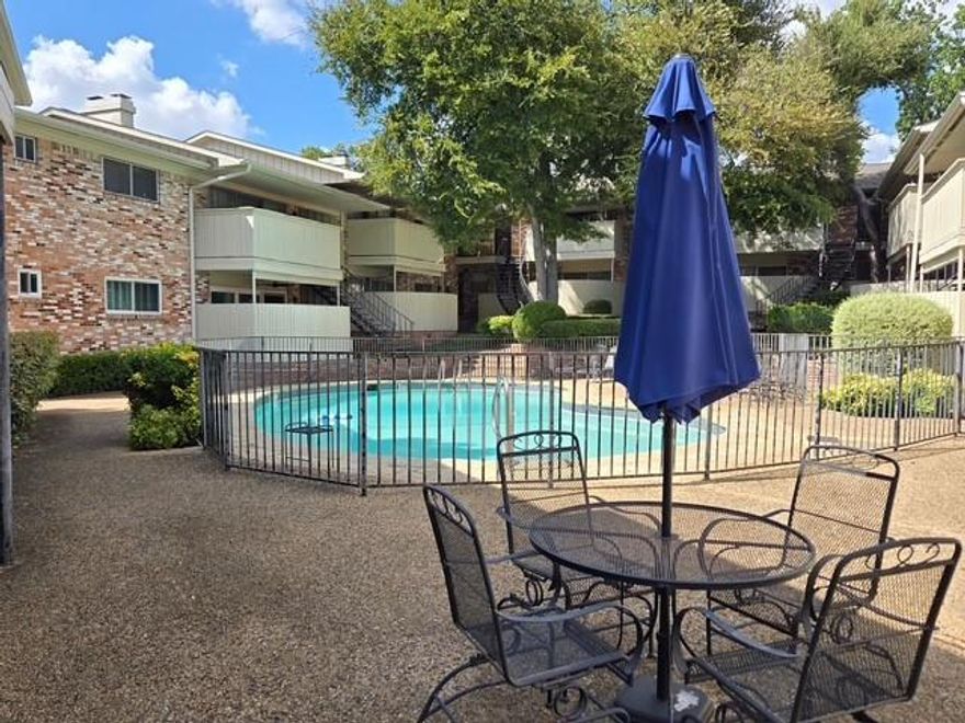 Beautifully updated condo with stainless steel appliances, decorative backsplash and refinished cabinets.  Unit also features beautiful flooring, designer light fixtures, an awesome fireplace with built in shelves and a patio.  Complex has great greenspace, beautiful trees and a creek.  Rent includes all utilities.  Condo is centrally located near shopping, transportation, restaurants and freeways.
