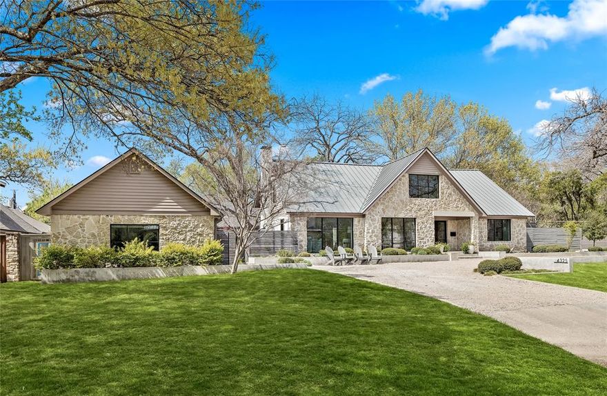 Situated on a prime corner lot in highly sought-after Bluffview, this exquisite residence spans nearly half an acre and offers unparalleled luxury and sophistication. Taken to the studs in 2019, this architectural gem was thoughtfully and meticulously curated and designed. Currently used as a 5 bedrooms, four baths, and a host of meticulously curated living spaces, an office suite, a workout room or additional study, and an expansive outdoor living area, this home is designed for both comfort and grand entertaining. The spacious, open-concept layout features a lavish living room with a grand fireplace, seamlessly connecting to the dining and kitchen areas, while a butler's pantry and bar extend to the outdoor patio, complete with a fireplace and turfed putting green. A private downstairs primary suite with a true spa-like provides an intimate retreat, while the upper level boasts three bedrooms, two baths, and a game room. Surrounded by verdant grounds and situated in close proximity to Dallas' finest private schools, steps from Bluffview Park, Love Field Airport and luxury amenities. This home harmoniously blends modern design, refined finishes, and an enviable location. You won’t want to miss this gem.