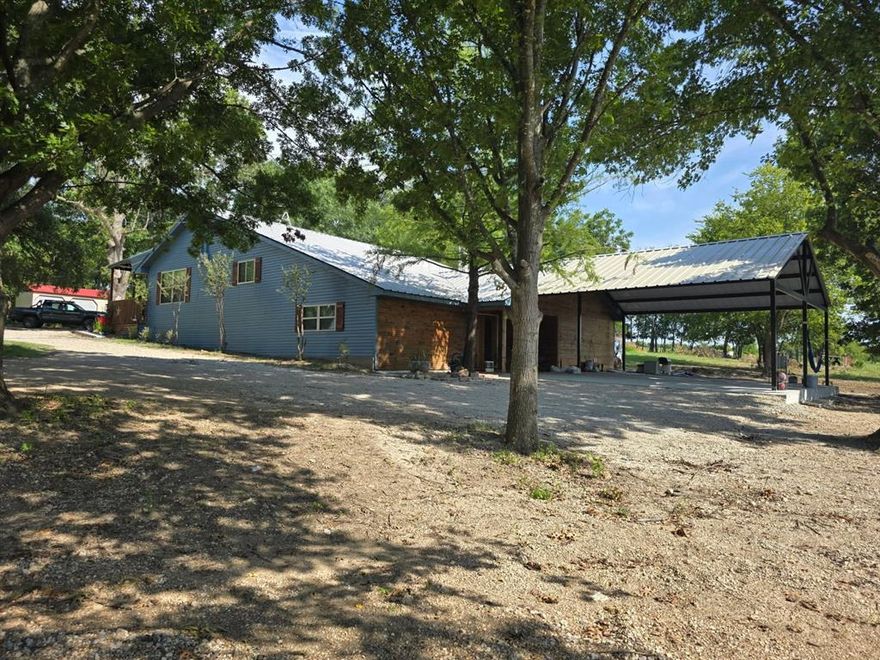 Ranch living at it's best! Enjoy this beautifully remodeled home sitting on almost 2 acres in Kemp, with quick access to highway 175 and less than 25 miles from downtown Dallas. Four bedrooms two and a half bathrooms, two living areas, beautiful kitchen with breakfast bar, quartz countertops, stainless steel appliances and a dream sized pantry. Split level with the main entrance on the higher end of the house, where an inviting covered porch welcomes visitors. Living, dining, kitchen and primary and extra bedroom & bathrooms in main level.  Lower level has two bedrooms, a half bath, a family room with a fireplace that can heat all rooms of the house. Recently built carport for 3 vehicles, complete separate laundry room, etc...This property has it all, from plenty of space, amazing woodwork detail, storage buildings and even a chicken coop to peach, apple, pear and pecan trees. Comfort, style and a peaceful environment complete the country feel. Bring your buyers to see!