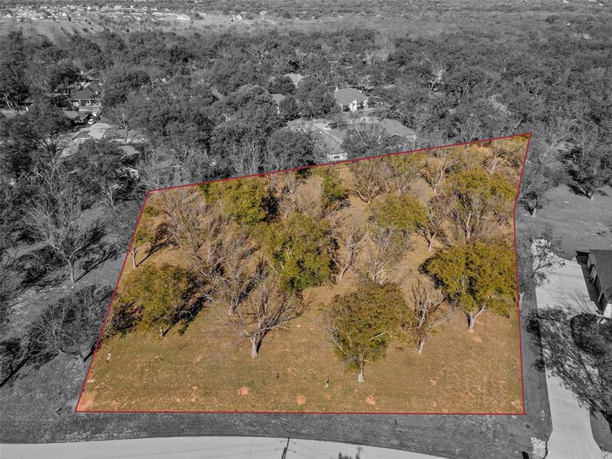 Large (1.4 A) lot in The Landings at Pecan Plantation, offering many mature Pecan trees, and elbow room to build your dream home. Lot measures 154 x 229 x 190 x 367. Development is complete with concrete roads, electric service, MUD water & sewer. Homeowners can also take advantage of Orchard irrigation; high speed internet is available. 2,000 SF minimum in this section of Pecan. Owner may use builder of choice. Mandatory HOA membership. PPOA Membership initiation fee to be paid by Buyer at closing.
