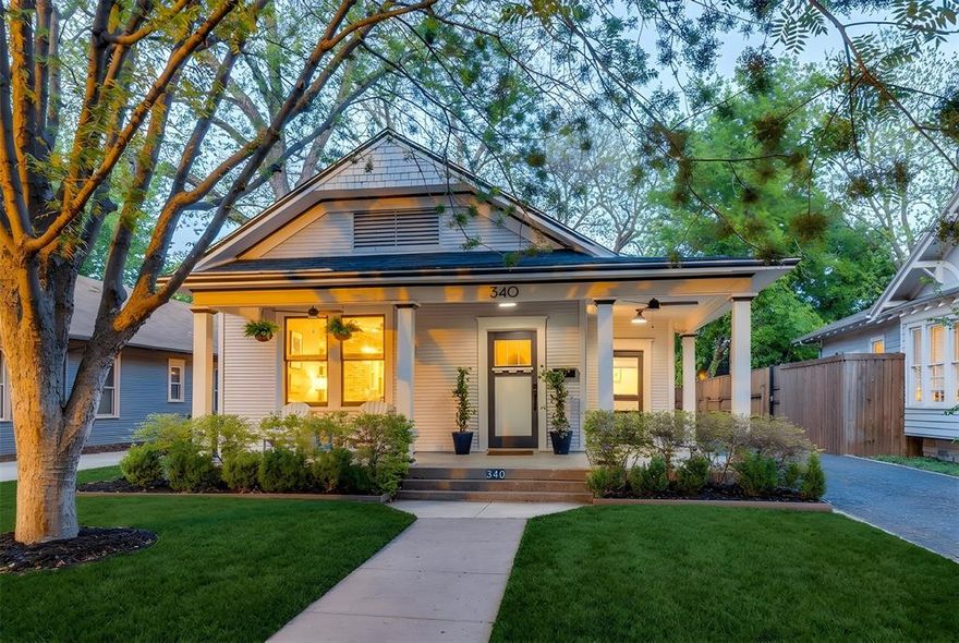 This quintessential Winnetka Heights cottage offers the perfect mix of vintage 1920s charm and sophisticated updates for today's living. The walkable and friendly century-old neighborhood offers character and architectural integrity that is thoughtfully protected by a City of Dallas Historic District designation. Extensive updating over the past decade have resulted in a modern open layout with fantastic flow between the living, dining and kitchen areas. Interior highlights include a spacious entryway, tall ceilings, exposed brick, hardwood flooring, mock fireplace, recessed lighting, a butlers pantry, walk-in pantry and laundry room, and glass doors leading out to the attractive backyard. Enjoy hosting guests in the beautifully renovated kitchen featuring stone countertops, KitchenAid stainless steel appliances, gas range, vent mechanism, farm sink, brass hardware, and soft-close cabinets and drawers. Bathrooms have also been updated with stylish tile, a modern freestanding guest bath tub with a rainfall showerhead, and a primary bath with double sinks, stone flooring & countertop, and a walk-in closet. The backyard is an entertainer's paradise with an oversized wood deck, built-in spa, grass lawn, board-on-board fence, storage shed and sprinkler system.  This attractive, inviting home is just minutes from Bishop Arts & Davis Street shopping and dining, Stevens Park Golf Course, Kevin W. Sloan Park and Dallas ISD's acclaimed W.E. Greiner Exploratory Arts Academy.
