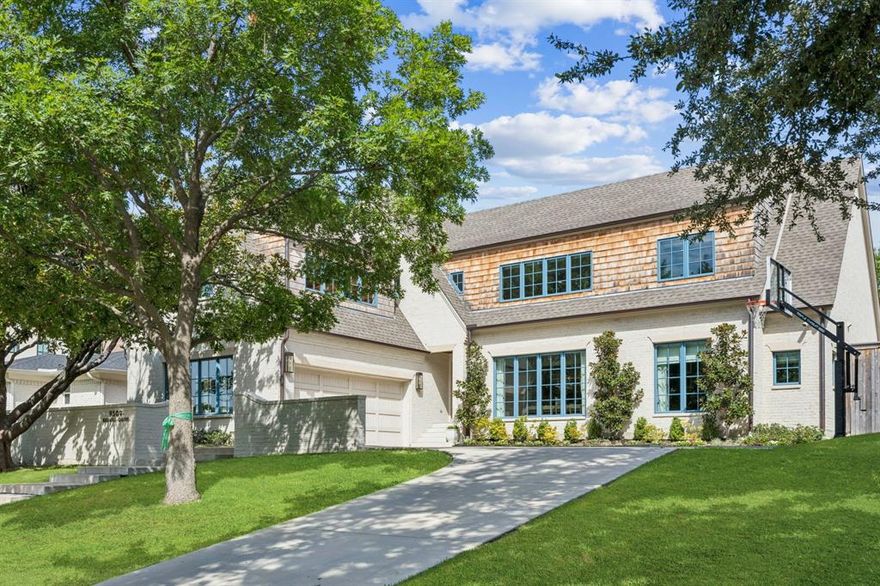 Perched on a gentle hill in the coveted White Rock Valley of Lake Highlands, this stately 5-bedroom, 4 full and 2 half-bath home built in 2020 is simply perfection. Designed with discerning taste and exceptional craftsmanship, every detail reflects luxury and thoughtful design.

Inside, you'll find reclaimed pine floors that exude warmth and charm, complemented by designer finishes at every turn. The butler’s pantry and library are elevated with exquisite Armac Martin hardware, while Thibaut and York wallpapers add layers of texture and sophistication throughout the home. The playful charm of Katie Kime’s Dallas Toile wallpaper creates a whimsical statement in the spacious playroom.

The gourmet kitchen and laundry room are both outfitted with stunning Cle Zellige tile, adding handmade character and artisanal elegance. Step outside to a true entertainer’s dream: imported Spanish tile sets the stage for an inviting outdoor dining area, a sparkling pool, and a lush backyard complete with a batting cage—ideal for sports enthusiasts of all ages.

This is more than a home; it’s a lifestyle—where high design meets everyday comfort, right in the heart of Lake Highlands.