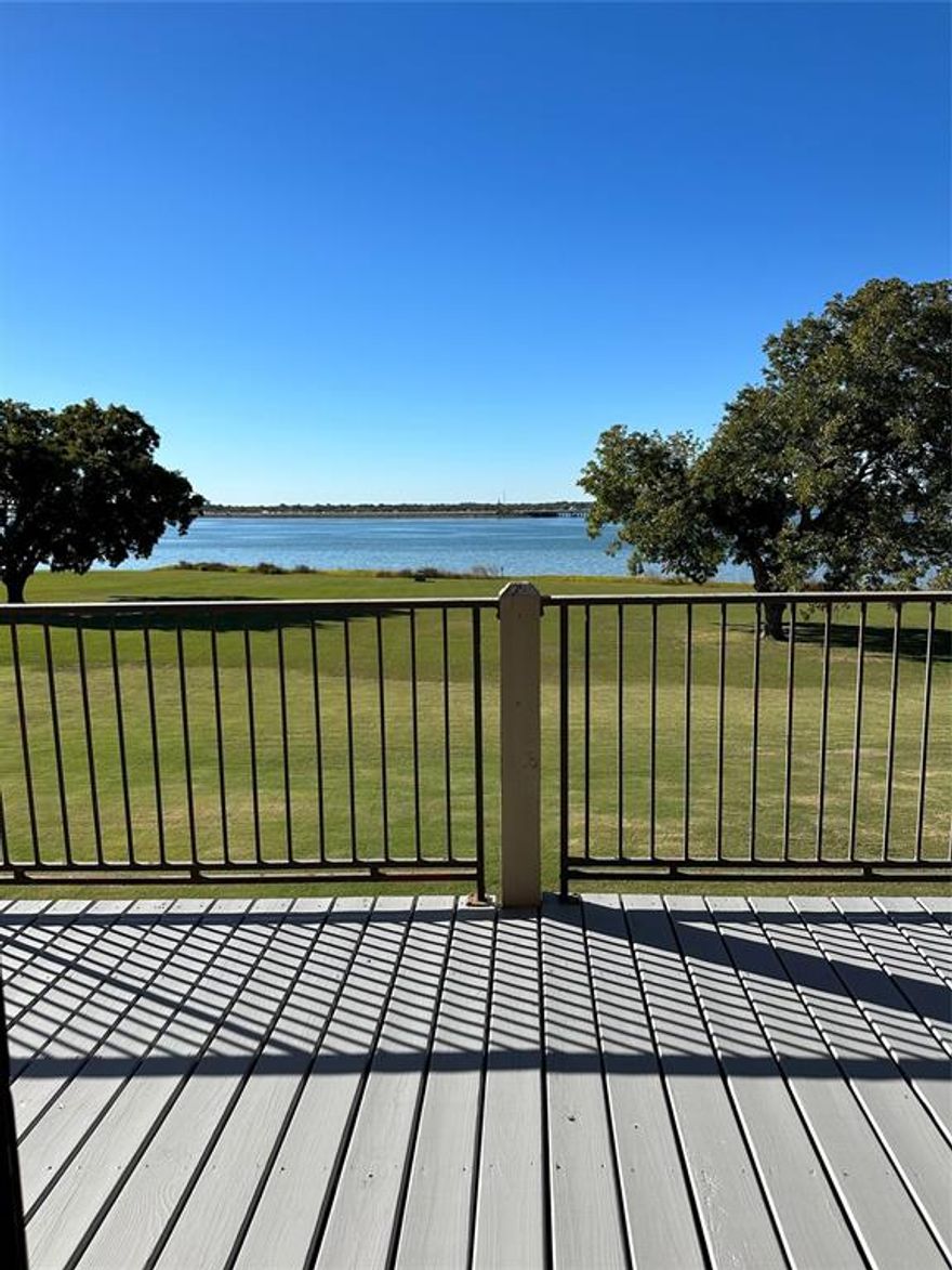 Waterfront Condo!!  Enjoy breathtaking sunsets, watch the storms come in or see sail boats glide by from your spacious balcony. The Harbor is a short stroll along the Lake to take in a movie, dinner or enjoy summer concerts. A wall of windows spans the width of the condo allowing the lake view to become your own ever changing scenic backdrop. New Stainless Steel Appliances in unit installed this week, including refrigerator, wine fridge,and new washer and dryer in laundry room. Updated kitchen with 42 inch cabinets open back-lit cabinets with adjustable glass shelving frame the built in microwave and glasstop range. Vaulted ceilings,crown molding,fresh neutral two-tone paint and Lovely oak floors throughout with tile in all wet areas. A spacious 15x14 Primary Bedroom welcomes the morning sun. The Living-Dining area is 21x15 and allows for stunning sunset memories. Two assigned spaces.