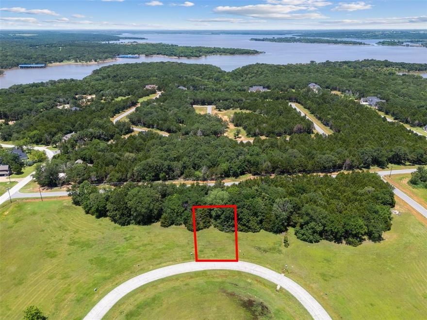 Don't miss your chance to own a prime interior lot in the prestigious Rock Creek Resort on Lake Texoma—North Texas’ premier luxury lakefront community! This build-ready lot on Palisades Circle offers the ultimate flexibility with no required build timeline, allowing you to create your dream home whenever you're ready.

Nestled in a gated resort-style community, this lot includes access to world-class amenities: a Jack Nicklaus-designed golf course, private marina with boat slips and rentals, resort-style pool, full-service spa and fitness center, upscale clubhouse dining, tennis and pickleball courts, scenic trails, and year-round social events that bring neighbors together.

Just one hour north of DFW, Rock Creek Resort offers a peaceful escape with unmatched value. Whether you're building your forever home, a weekend getaway, or securing an investment in one of Texas’ fastest-growing lake destinations, this property checks every box. Utilities are already in place, and HOA dues include security, amenity access, and common area maintenance.

Lots like this are limited—act now to secure your place in paradise!