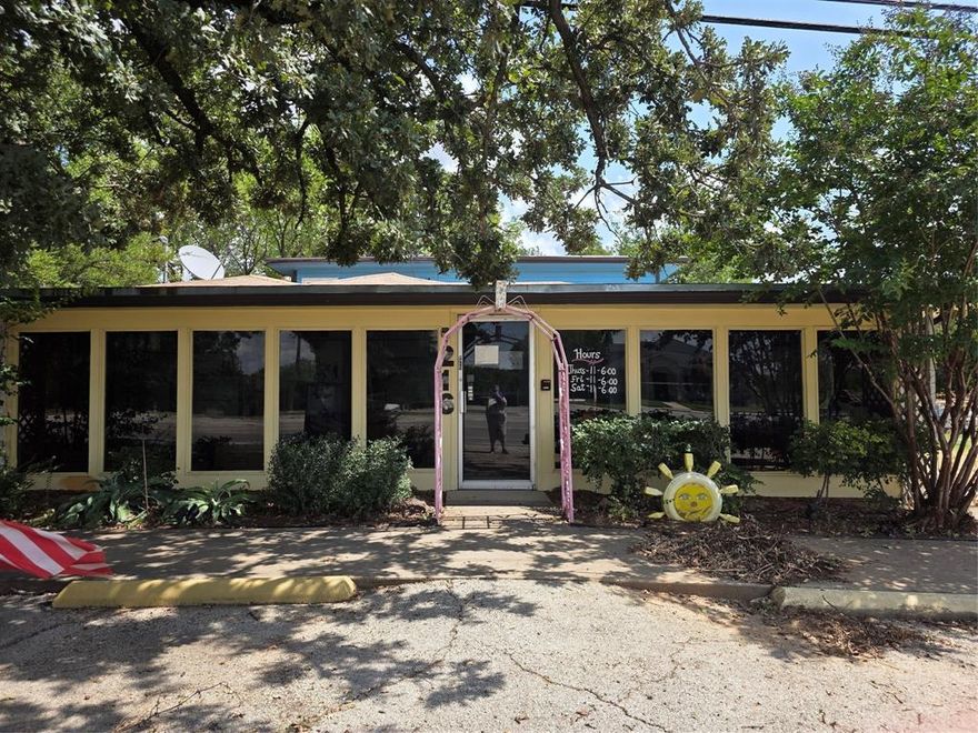 Sitting on just over quarter-acre in Original Town Azle is this iconic building with full plate glass storefront windows.  However, that is just one of 3 buildings, parking a second story apartment and a pond on this site.  the front building, with store front boasts over 2,000 sq ft of retail,office,multiple use spaces with half bath up front and full bath with shower and laundry in back. Upstairs is 2 bed, 1 full bath with galley kitchen,pantry and private deck for relaxing or entertaining. additionally there is a 9x10 storage buildung and a 18x20 tall metal building with loft, electric servive and large sliding garage doors. At the back of the property is pond. You reallly have to see this property to appreciate all the options and possibilities. it was last used as a booth for rent business allowing local artisans to sell arts,crafts,antiques and military equipment. it has been closed and utilities are off.