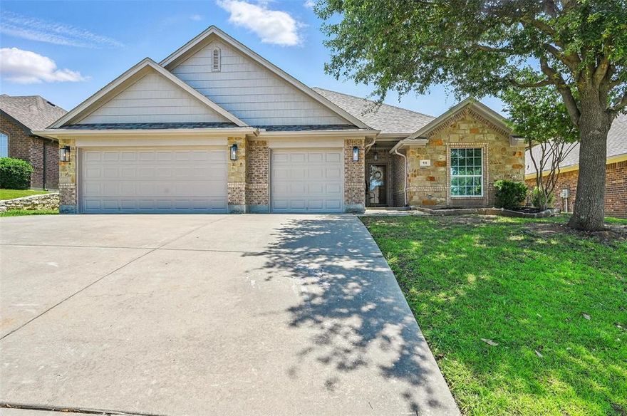 Welcome to this beautifully maintained 4 bedrooms, 3 bath home featuring a spacious 3 car garage, located in the desirable Meadow Crest neighborhood. It sits across the street from Meadow Crest Park which features a walking trail, pickleball court & new playground. When you enter the home, you step into a large living area with elegant, engineered wood floors with a cozy wood burning fireplace, perfect for relaxing or entertaining. The expansive eat in kitchen boasts granite countertops and granite island, stainless steel appliances, and a view of the private backyard. Enjoy outdoor living under the large, covered porch, with a storage shed for added convenience. This smart layout includes split secondary bedrooms for added privacy. All bedrooms and baths are large! The 4th bedroom is ideal for guest suite or multigenerational living, offering easy access to a full bath. The private primary suite includes an en-suite bath with a garden tub, separate shower, and dual vanities. Recent updates include fresh exterior paint, new coach lights, and a newly stained privacy fence. Move-in ready and full of charm! Don’t miss your chance to own this exceptional home!
