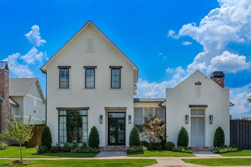 Built custom in 2020, this architectural showpiece in Provenance Community blends cutting-edge design with effortless livability. Positioned on an oversized corner lot, the property offers a rare combination of privacy, space, and modern elegance. Inside, tall ceilings and expansive windows and transoms bathe the interiors in natural light, while sleek lines and curated finishes create a refined, contemporary aesthetic. All design and selections were made by local interior designer. Designated Foyer. Every space has been thoughtfully designed to balance comfort with style, from the open living areas to the private sleeping quarters. White Oak floors throughout main floor. The Chef’s Kitchen is a statement of form and function, showcasing quartz countertops, marble backsplash, premium Thermador appliances with matching cabinet fronts and a grand island that invites both intimate dining and large-scale entertaining. Massive pantry. The Kitchen is flanked by a Formal Dining or Breakfast. The main level hosts a serene primary suite with spa-caliber bath, a downstairs guest suite and a sophisticated home office. Wallpapered Powder Room. Upstairs, two spacious bedrooms, one bath and an upstairs den. Outdoors, a heated pool shimmers as the centerpiece of a private alfresco retreat, framed by generous lounging and dining areas including beautiful brick arches, an Outdoor Kitchen, fireplace, and more, perfect for year-round enjoyment. Outdoor bathroom. Separate exterior entrance for outdoor area only, perfect for entertaining. The oversized lot enhances the home’s sense of openness, while the corner position offers exclusivity and curb appeal. A rare offering for the discerning buyer seeking modern luxury, exceptional craftsmanship, and an address that embodies prestige. Schedule a private tour and experience this extraordinary property firsthand. Enjoy a wonderful way of life in Provenance with nearby Clubhouse, pool, gym, restaurants, bank and more.