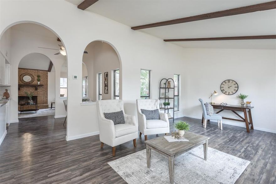 Recently updated and refreshed, this cute 3 bedroom, 2 bath home in established Lewisville neighborhood is ready for its new owner! Spacious entry with vaulted ceilings. Two living areas, with wood burning fireplace in Den. Well-appointed, eat-in kitchen with granite countertops, white cabinets with hardware, pull-out drawer pantry, microwave, dishwasher and electric range. Primary bedroom includes ensuite bathroom with tile surround shower and storage. Ceiling fans in all bedrooms. Great storage with two linen closets in main hallway. New laminate flooring throughout home. Covered patio perfect for outdoor entertaining and relaxing. Located convenient to Hwy 121 and I-35.