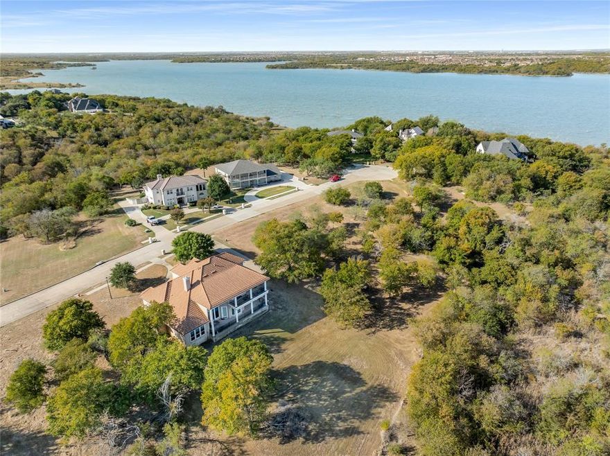 Discover the beauty of Joe Pool Lake with this one-of-a-kind .5-acre lakefront lot.  Nestled in the upscale, quiet Lake Ridge Community.  This build site is perfect for your custom home. The lot is wide enough for those seeking a ranch-style house plan.  Surround yourself in nature on this private cul de sac. Additional community highlights include Lake Ridge Property Owner’s Association, Tangle Ridge Golf Club an 18-hole championship public course, parks with walking trails, and minutes from Sports Park, and Shopping and Lynn Creek marina, boat ramp, and clubhouse.  30 to 45 Minutes to Down Town Dallas, Ft. Worth, DFW Airport, and Ball Parks in Arlington.