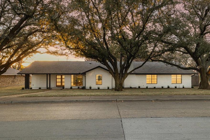 Welcome to 12151 Crestline — where timeless design meets modern luxury in Dallas’s coveted Private School Corridor. Fully reimagined from top to bottom, this four-bedroom, three-bath home features a bright open layout, multiple living areas, and seamless indoor-outdoor flow through a 12-foot sliding glass door. The chef’s kitchen offers custom cabinetry, a quartz waterfall island, and premium Thor appliances. Wide-plank white oak flooring, Kohler fixtures, and designer lighting elevate every room. The primary suite includes double walk-in closets and a spa-like bath with dual vanities and an oversized shower. Outside, mature live oaks and a spacious patio create an inviting space for entertaining. With a three-car garage, epoxy floors, and a prime location near top private schools, major highways, and upscale dining, this home perfectly blends comfort and sophistication.