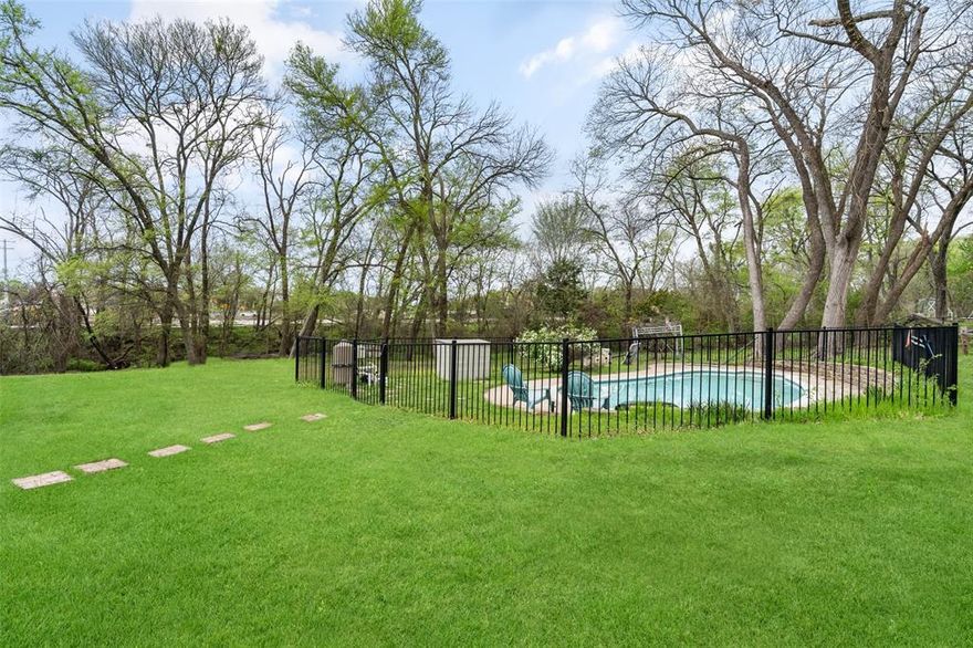 Price reduced!
Situated on approximately 1.89 acres in Lucas, Texas, this well-maintained property offers a peaceful setting with convenient access to nearby amenities and is located within the Lovejoy Independent School District.

The open floor plan connects the living, dining, and kitchen areas, creating a functional layout suitable for everyday living and entertaining. The living room features vaulted ceilings, a fireplace, and large windows that provide lots natural light and views of the surrounding property.

The kitchen includes modern appliances, ample cabinetry, generous counter space, a pantry, and a breakfast nook overlooking the backyard. The primary bedroom includes a walk-in closet and an en-suite bath. Secondary bedrooms provide additional space and storage, and a versatile flex room can be used as a home office, study, or additional living area. The laundry room includes a walk-in storage closet.

Outdoor features include a swimming pool in a fenced backyard, along with a screened porch for outdoor relaxation. A separate fenced area offers additional flexibility for pets or outdoor activities. Mature trees and an expansive yard contribute to the property's natural setting.

Additional improvements include an attached two-car garage, a detached two-car carport, and a storage shed, providing ample space for vehicles, tools, and equipment.

Located minutes from Lake Lavon with convenient access to shopping, dining, and regional roadways.