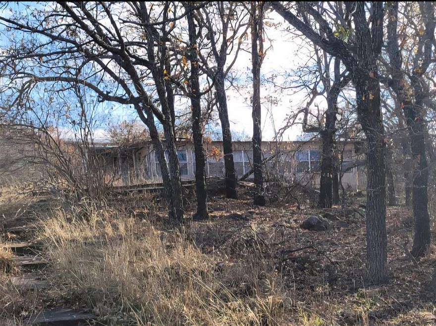 This is about an acre and a half of beautiful Lake Brownwood Land in the Tamarack Mountain area overseeing the lake. The property with a single wide mobile home does have a small storage building and a small carport. The property sits up above the side of a hill with several trees and beautiful scenery. This single wide home comes with one bedroom, bathroom, kitchen and laundry area. The home has been vacant for some time and does need repairs. With a little work this could be a nice Rest & Relaxation spot.