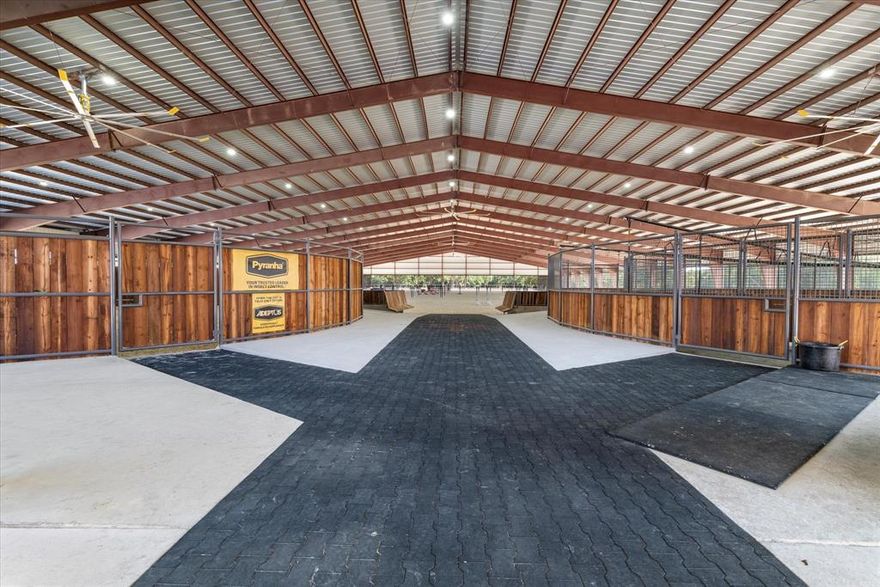 $50,000 Seller Credit for clearing and homesite improvement. State of the art newly constructed ranch is now being offered for sale. Fenced 40 + or -Ag Exempt acres offers an abundance of wildlife and multiple stock ponds. Newly built barn with 40 stalls. Multiple tack rooms. Stalls with automatic waters and fans, fly system, Camera ready, Big ass fans, Farrier and vet area with under light LED system, 6 wash rack stalls, multiple feed rooms. attached is a 300x200 covered riding arena. Ebb and flow system controlled by phone 8 horse walker. Shop with hay and shaving storage and RV Hookup. 4 bed 2 Bath living space within the shop. Well, City water. No Restrictions. This will need to be Metes and Surveyed out of larger Tract of property.