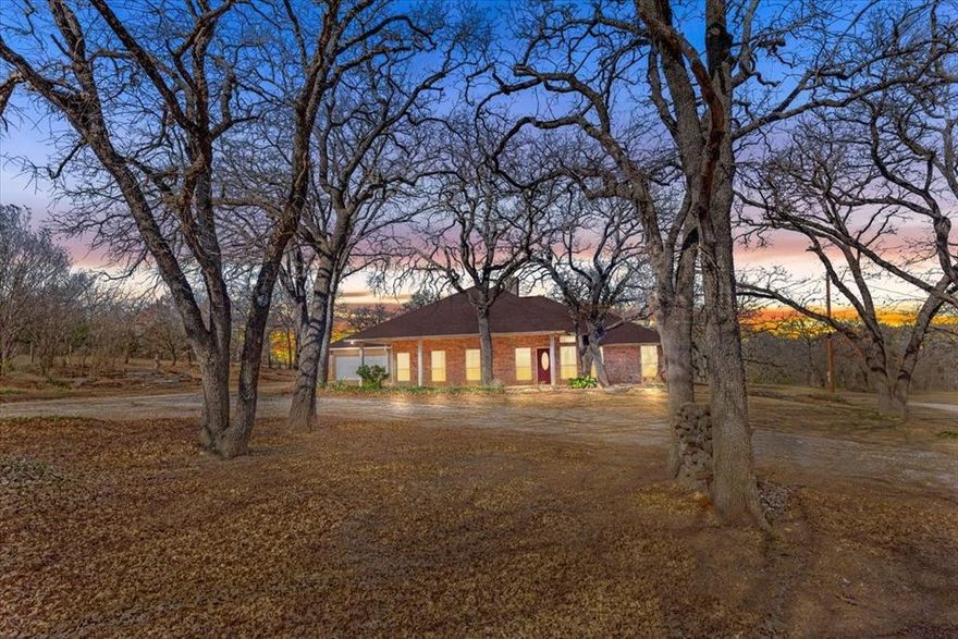 Rare opportunity in Mansfield ISD! This 10-acre property offers space, versatility, and endless potential—properties like this are seldom available in the area. The 3-bedroom, 3-bath home spans 2,513 sq ft and provides a solid foundation for a buyer ready to make it their own.
The land features a seasonal pond, RV hookup, metal storage building ideal for equipment or recreational toys, and multiple loafing shed for animals. The property is fully set up for a second residence or future home build. The mobile home currently on site will be removed prior to closing and does not convey. A pipe-fenced entrance welcomes you to a peaceful setting that feels miles away from it all while remaining conveniently close to town. Property is being sold AS IS; seller will make no repairs. A truly rare offering with acreage, flexibility, and location in one package.