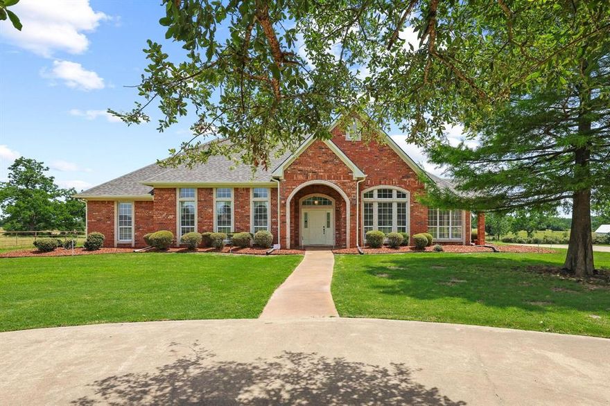 3,842 square feet of thoughtfully designed living space on 1.6 private acres just minutes from town.

The single story floor plan opens with two distinct dining areas, giving this home a natural rhythm between everyday meals and the kind of dinners that linger. The kitchen is the heart of it with an island at the center, generous counter space, and a layout that actually invites people to gather rather than just pass through. Fresh paint throughout gives the interior a clean, move-in-ready feel that's easy to make your own from day one.

The living room fireplace anchors the main space, and the natural light that moves through the back of the home toward the patio makes the transition between inside and outside feel seamless.

The primary suite is quietly impressive with a walk-in closet with real storage, exercise room, a soaking tub for the end of a long day, and a separate shower. Three bedrooms, two and a half baths total, with a generous private office and a bonus room that works equally well for hobbies, a second office, or whatever this chapter of life calls for.

Outside, the backyard and patio setup is the kind that makes you forget you had plans. A pull-through garage offers flexible space for a boat, tandem parking, or storing the outdoor toys that come with 1.6 acres of room to use them.

Roof replaced May 2026. Year built is estimated 2000.