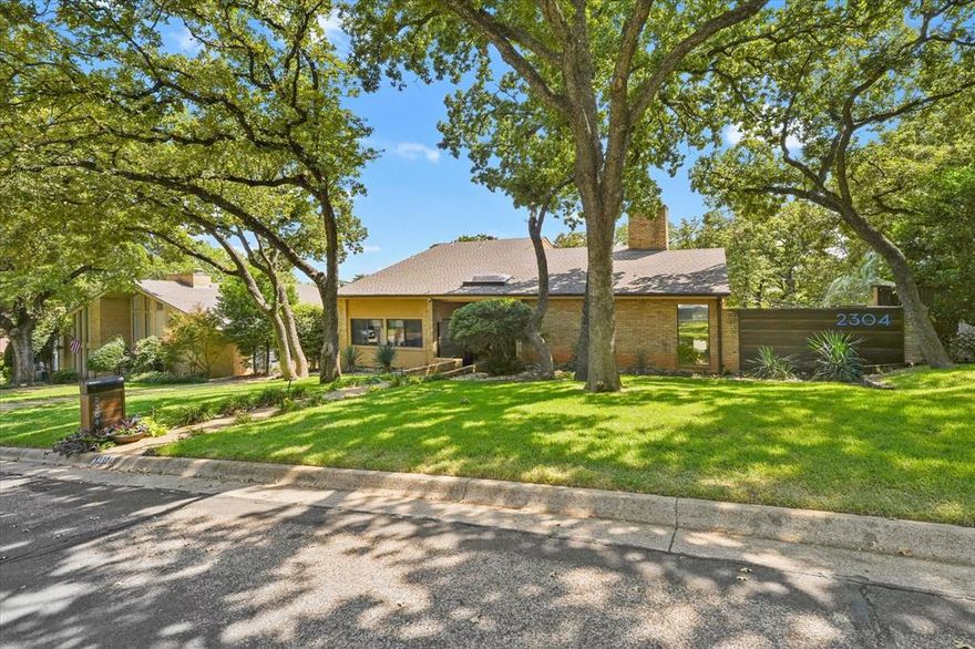 Welcome to 2304 Oak Forest Court, an elegant sanctuary in Arlington, TX, offering refined living in a serene setting. This sophisticated residence encompasses 2,433 square feet of thoughtfully designed space, featuring three spacious bedrooms and two and a half luxurious bathrooms. Upon entering, you'll be captivated by the refined atmosphere, accentuated by floor-to-ceiling windows that bathe the interiors in natural light. The home boasts tasteful ceramic wood-style flooring and an inviting wood-burning fireplace that anchors the living area, creating an ideal space for both entertaining guests and enjoying quiet evenings. The gourmet kitchen is a culinary enthusiast's dream, outfitted with sleek granite countertops and high-end stainless steel appliances. This stylish space seamlessly connects to a sunken family room, setting the stage for memorable gatherings. Retreat to the primary suite, a private haven with a spa-like bath featuring exquisite quartz finishes, a glass-enclosed shower with luxurious body sprays, and a rejuvenating jacuzzi tub. A custom walk-in closet offers ample storage space, ensuring an organized and clutter-free environment. Step outside to discover your personal oasis—a sunlit terrace and a sparkling pool invite relaxation and leisure, set against a backdrop of lush landscaping. This outdoor sanctuary is perfect for alfresco dining, morning coffee, or unwinding after a long day. Additional amenities include a spacious attic for extra storage, a convenient laundry room with a washer and dryer, and a 2-car garage. The home also offers the convenience of air conditioning, providing comfort during warm Texas summers, while ample parking solutions accommodate guests with ease. Situated on an expansive 11,412-square-foot lot, this distinguished property combines elegance with practicality, offering a harmonious blend of luxury and comfort. Don't miss the opportunity to make this extraordinary residence your own.