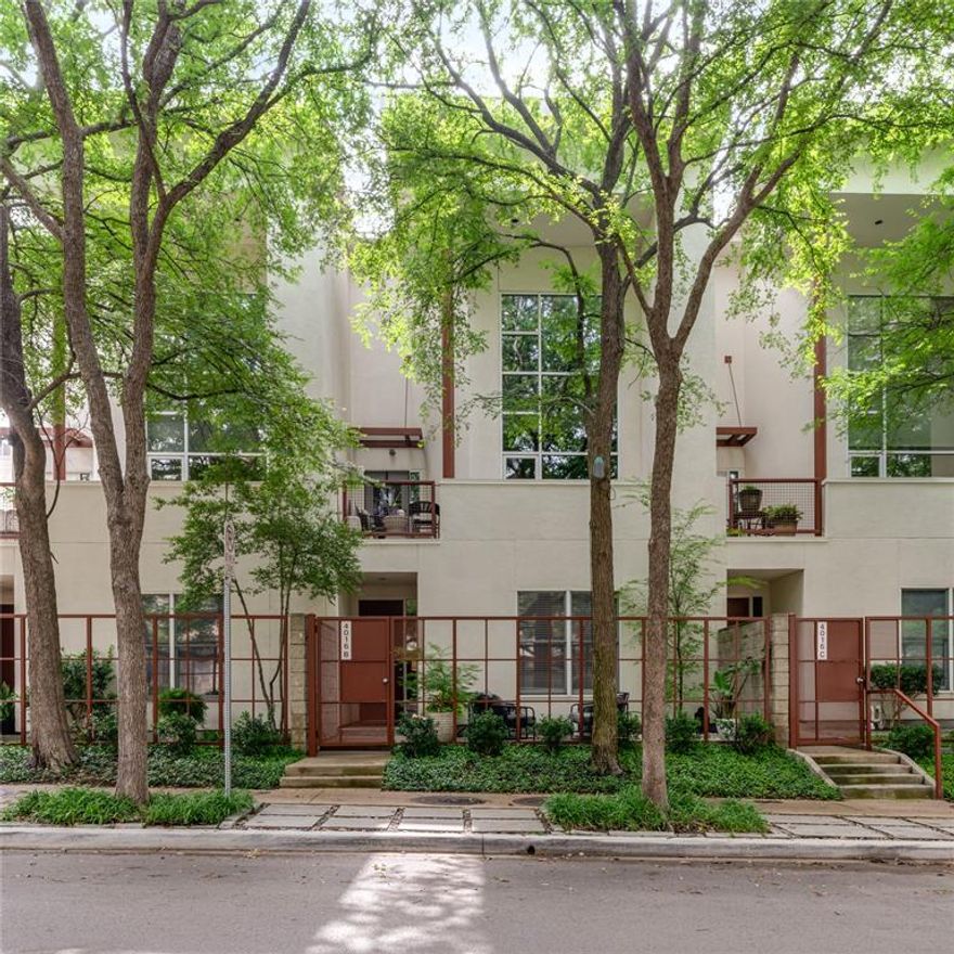 This stunning 3-story townhome is ideally located near vibrant Knox, Katy Trail, and West Village, offering both convenience and luxury. The spacious open-concept features a kitchen that flows into the dining area and living room, with large windows framing serene tree-line views. Off the living room is a terrace for seamless indoor and outdoor entertaining. On the first floor, you'll find a courtyard perfect for relaxation, complete with a seating area, offering a great outdoor escape. The expansive bedroom suite on this level provides ultimate comfort and privacy, making it a perfect retreat. The third floor is an owner's retreat with a primary suite and office. The primary bath features a separate shower, bathtub and vanity with dual sinks. The spacious closet connects to a private loft space that can be used as an office, second living area or home gym. Additional features include Klipsch built-in speakers throughout, hardwood floors on the second and third floor, concrete floors on the first floor, a downstairs utility room and two-car garage with built-in storage. This townhome combines modern amenities, style, and an unbeatable location.