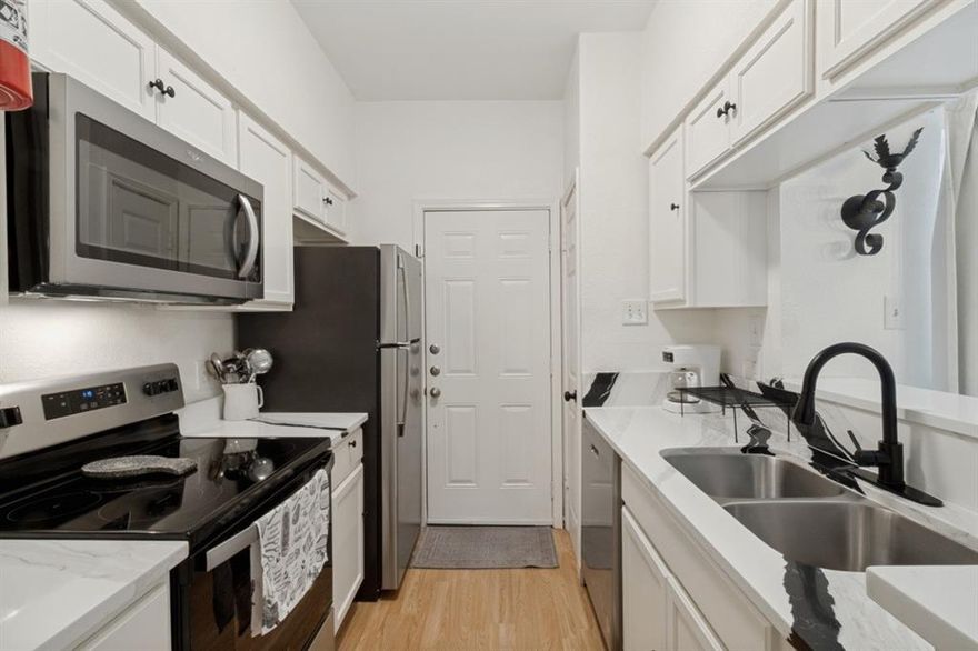 Exquisitely renovated 2-bedroom, 1.5-bath condo in a secure gated community — fantastic opportunity for investors or first-time buyers. This turnkey residence showcases brand-new everything: stainless steel appliances, quartz countertops, custom cabinetry, luxury plank flooring, fully updated baths, fresh neutral paint, and a new HVAC system with transferable warranty. Popcorn ceilings removed for a clean, modern finish. Bright, open floor plan with excellent natural light and low-maintenance living. Conveniently located near shopping, dining, transit and major routes. Move-in ready — exceptional value in a desirable location.Every detail has been thoughtfully upgraded, making this condo a perfect blend of style, comfort, and convenience in a prime location. Don’t miss your chance to own a completely renovated home ready for its new owner! Schedule your tour today!
